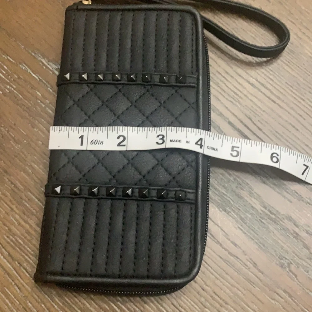 Unbranded black with black brads wristlets
